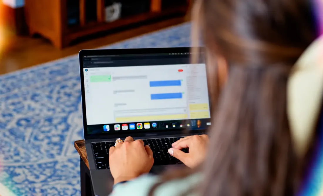 Student chatting on a laptop
