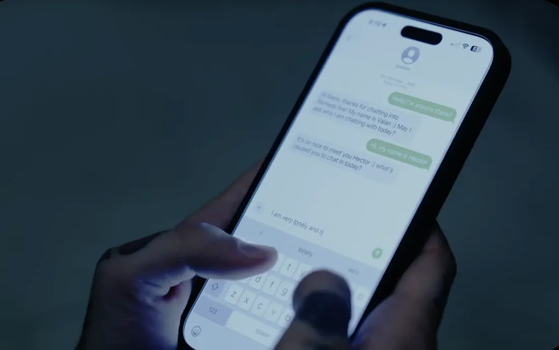 Hands typing a text chat on a phone